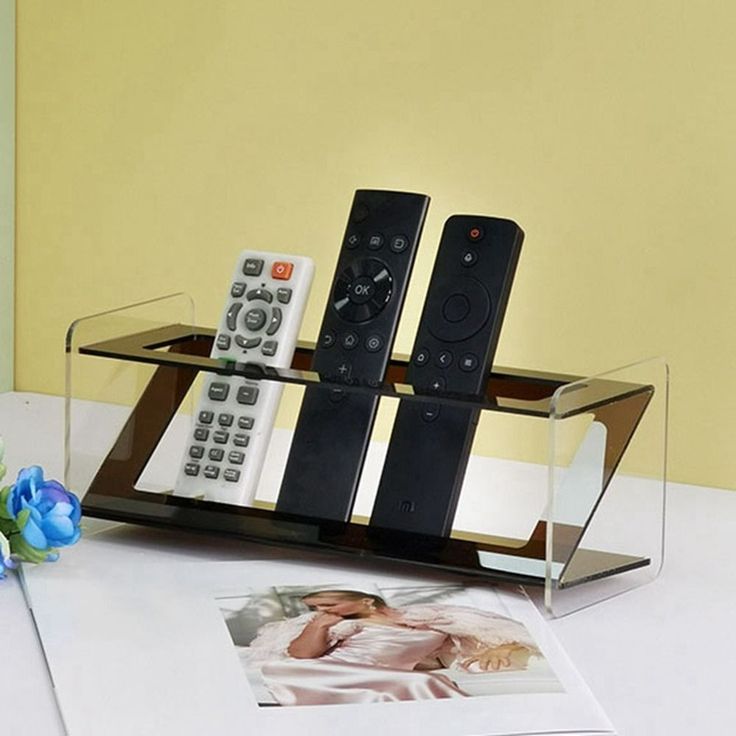 Acrylic remote holder with bold black accents, 10x24x10cm