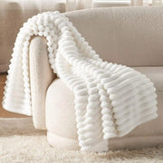 Thick ribbed fleece blanket with soft velour texture in 6 by 6 size.