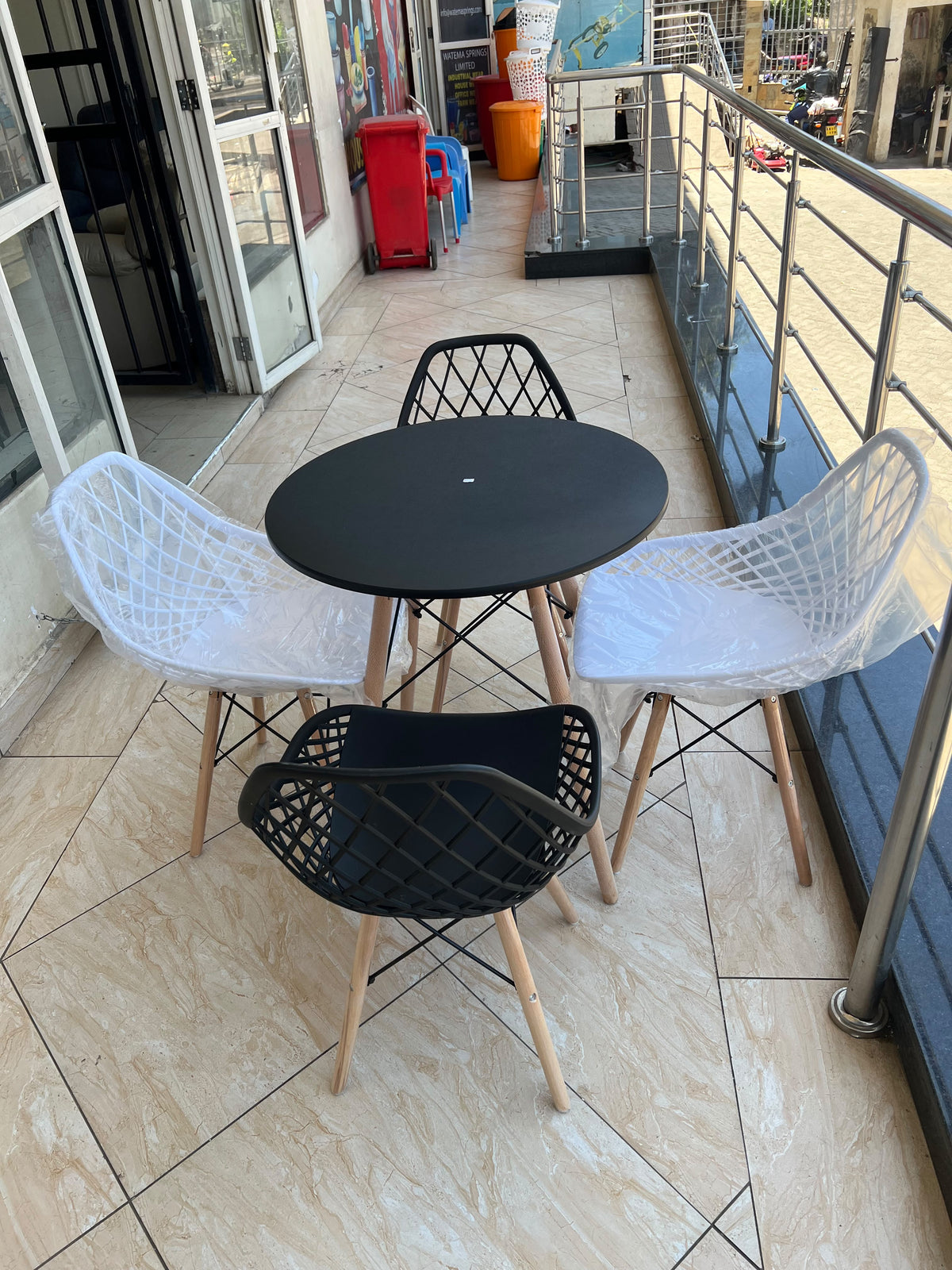 Indoor/Outdoor Black and White 4 Seater Table Set with Mesh Eames Chairs
