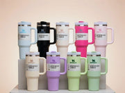Stanley 1.2L insulated stainless steel mug with handle and straw lid.