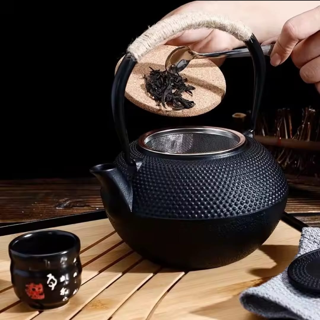 Cast iron tea pot with infuser, cast iron coaster and spoon