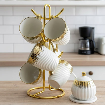Set of six gold rain textured mugs with handles.
