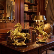 Gold decorative horse sculpture available in two elegant designs for home and office décor.