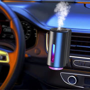 Grey Intelligent Car Aroma Diffuser with 3 refill bottles and USB cable.