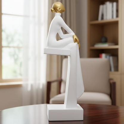 Art resin sculpture of a sitting woman available in black and white for home or office décor.
