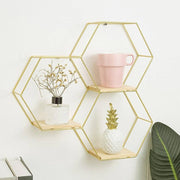 Dawood Lifestyle & Gadgets kes 3-piece gold hexagon wall shelf set with natural wood bases in a honeycomb floating design for modern home décor.