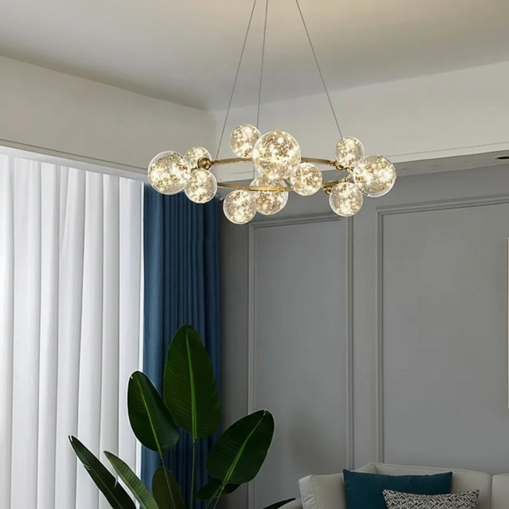 Dawood Lifestyle & Gadgets kes 12-bubble LED chandelier featuring crackled glass globe lights on a gold circular frame, luxury ceiling lighting for dining rooms, living rooms, hotel lobbies, staircases, restaurants, and modern interiors.