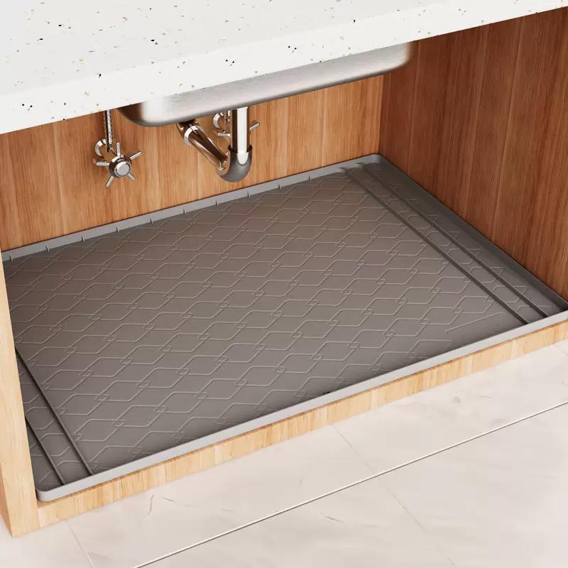 Silicone waterproof under sink shelf mat 86.4x58.5cm, cut to fit cabinet liner for leak protection. 
