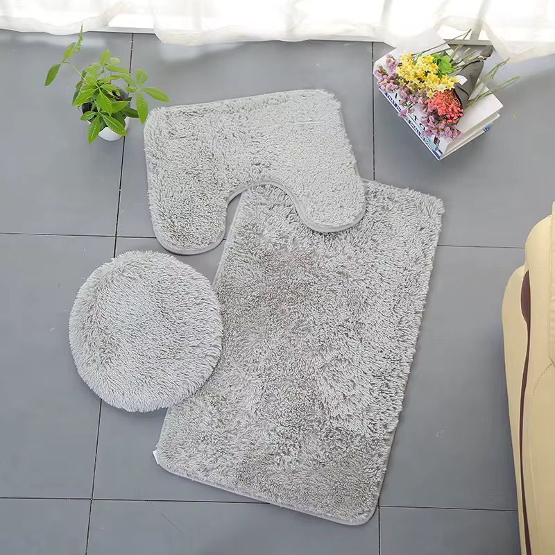 3-piece fluffy bathroom mat set with non-slip backing, includes bath mat, U-shaped toilet mat, and lid cover in colorful designs