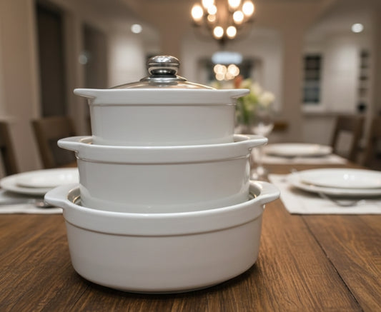 Set of three white ceramic serving bowls