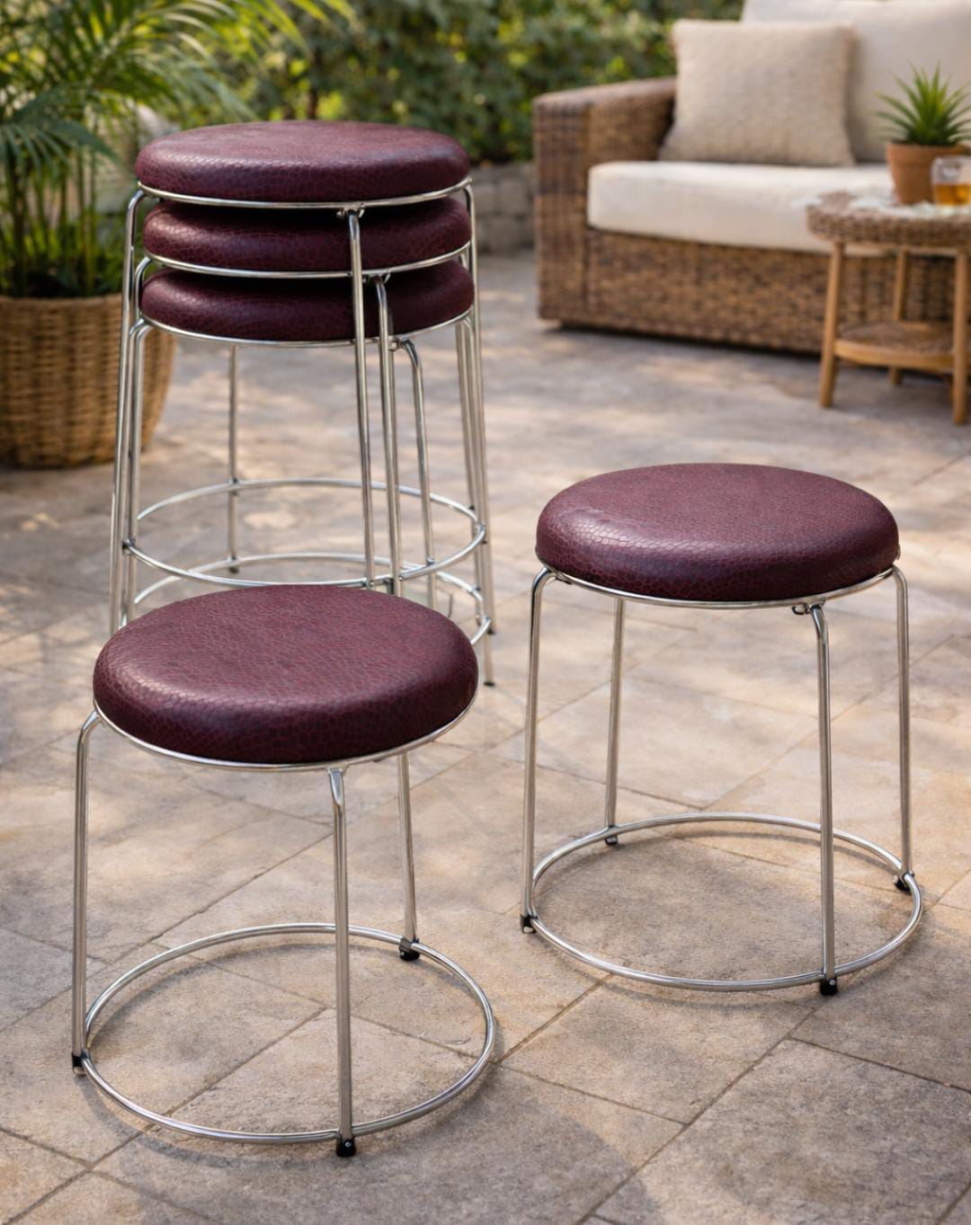 Stackable stools in green grey and maroon compact seating for space saving use