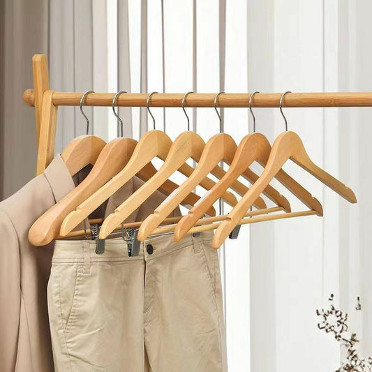 Light brown wooden clothes hanger for shirts, jackets, and pants