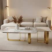 Dawood Lifestyle & Gadgets kes 2-piece nesting coffee table set with white marble top, grey and gold veining, and gold stainless steel geometric frame for luxury living room décor.