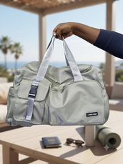 Green waterproof gym and travel bag with spacious interior for carrying essentials.