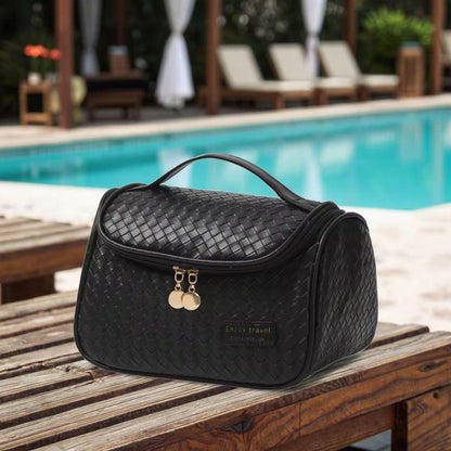 Portable leather makeup and cosmetics organizer bag in pink, brown, or black.