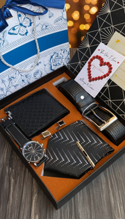 Men’s Valentine gift pack including watch, tie, belt, wallet, cufflinks, card, and gift bag.