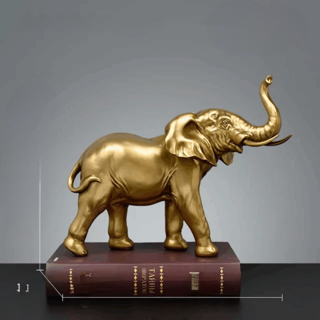 Golden Elephant Figurine With Raised Trunk