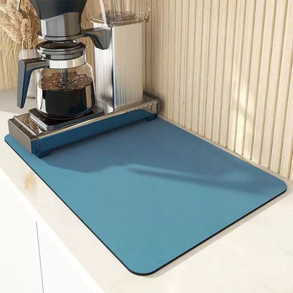 High absorbent dish draining mat on kitchen countertop for drying dishes.