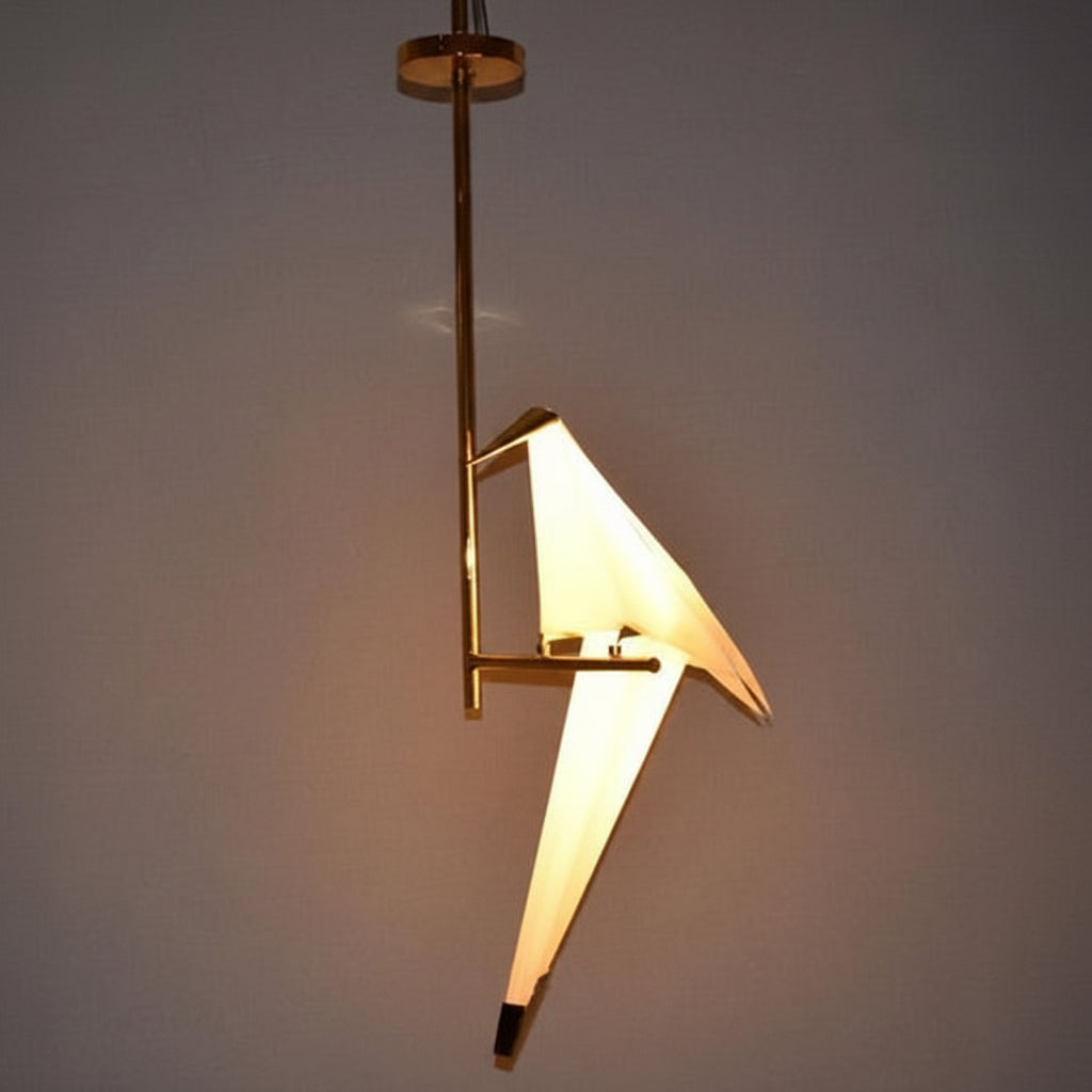 Metal bird shape tabletop lamp with decorative design.