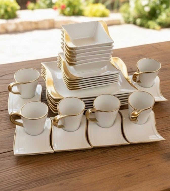 30-piece ceramic dinner set with gold accents including plates, bowls, cups, and saucers
