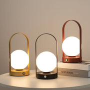 Modern rechargeable cordless table lamp with decorative lantern design and USB charging for bedside tables, consoles, and home décor.