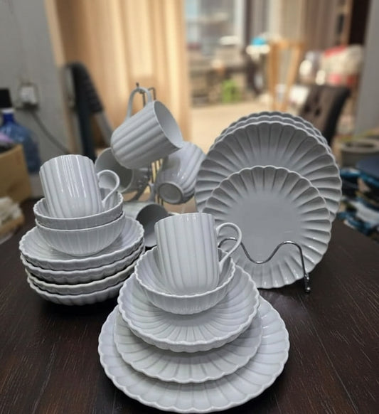 European scalloped ceramic porcelain 30 piece dinnerware set with plates bowls and mugs.