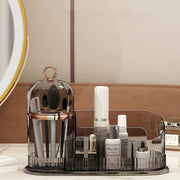 Makeup organizer box with compartments for cosmetics, brushes, lipsticks, skincare products, and cotton pads