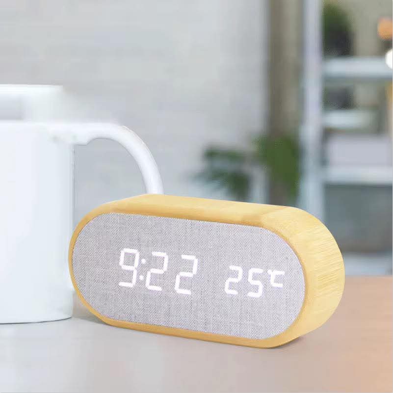 Wooden digital alarm clock with wireless charging and LED time, temperature, and humidity display