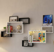 Three wooden rectangular connected floating shelves mounted on a wall.