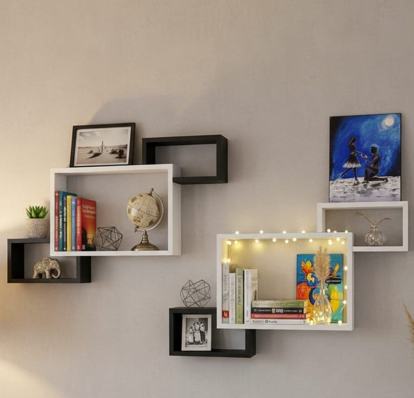 Three wooden rectangular connected floating shelves mounted on a wall.