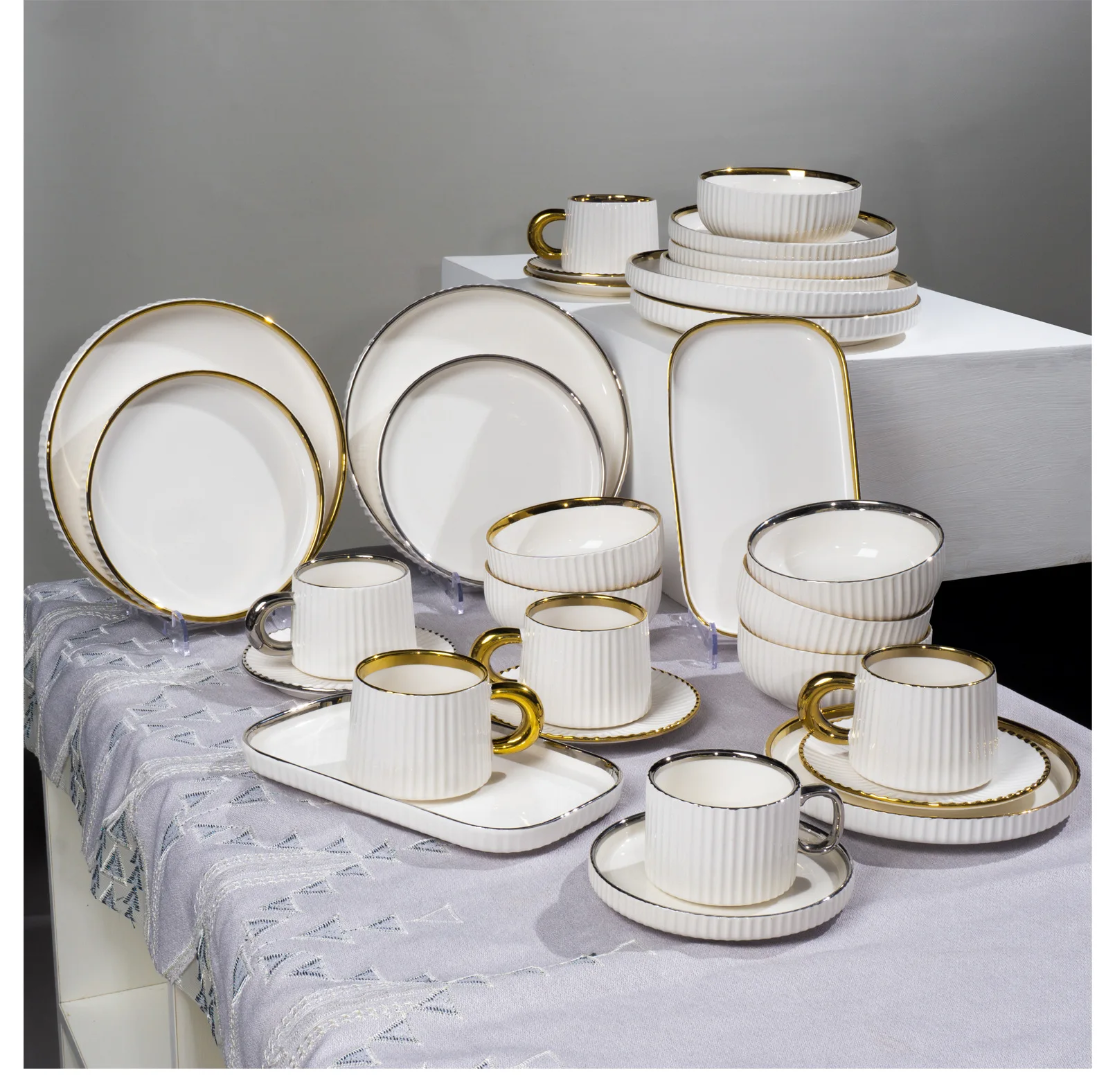 32-piece porcelain dinner set with plates, bowls, mugs, cups, saucers, and rectangular platters for dining and serving.