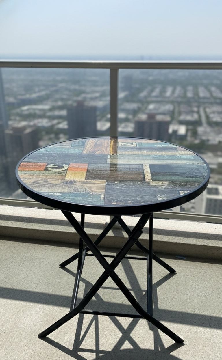 Foldable round accent table, portable and modern design.