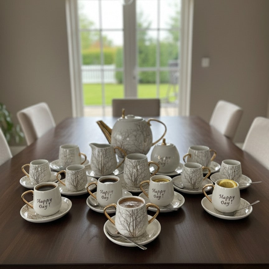 28-piece Palm tree design tea set with gold touch including cups, saucers, and kettle
