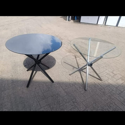 Round Clear Glass Dining Table with Metal legs.