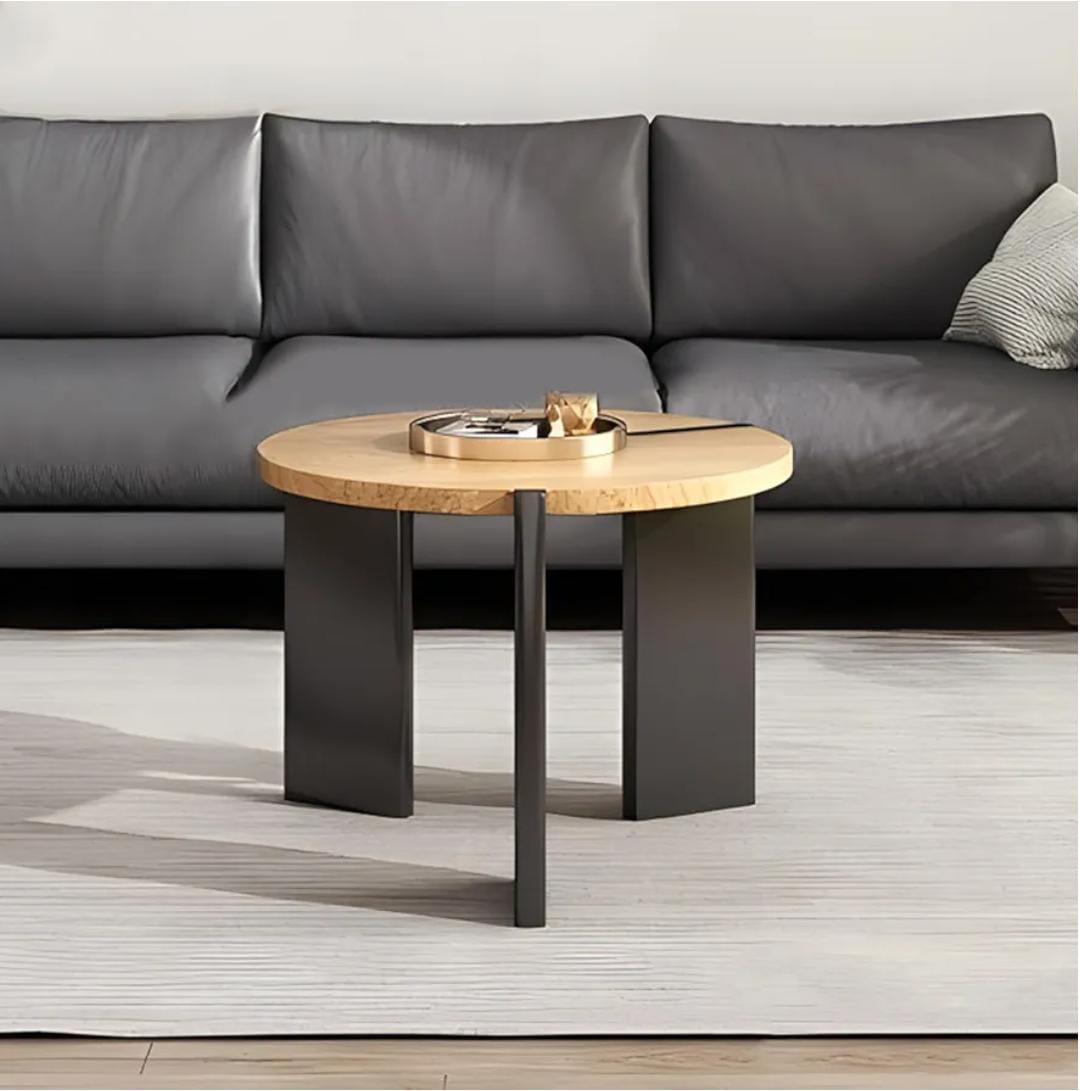 Modern round coffee table with solid wood top and black legs, natural finish, suitable for living room or bedroom small spaces