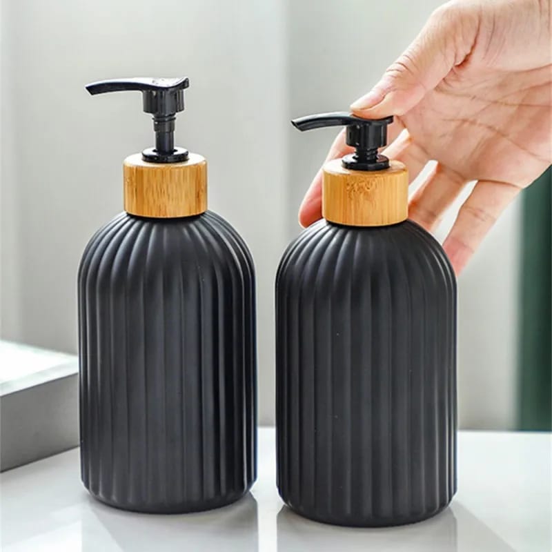 Glass soap and lotion dispenser for bathroom use