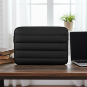Puffy laptop sleeve for 13.3-inch laptops with padded protection.
