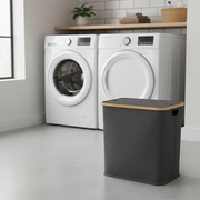Black bamboo laundry storage hamper with multiple sorting compartments.
