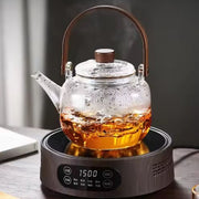 Heat resistant 1 litre glass teapot with built in tea infuser, ergonomic handle, and smooth pour spout for brewing loose leaf and herbal teas.