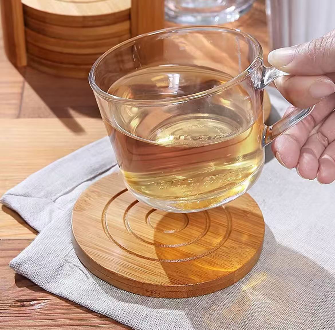 Six piece set of round bamboo coasters for protecting surfaces from heat, stains, and scratches