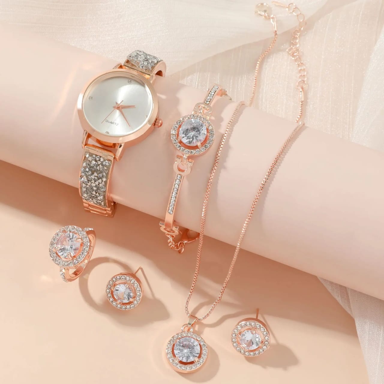 Five piece ladies watch gift set including watch, bracelet, necklace, ring, and earrings in gift packaging