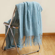 Soft knitted throw blanket with tassels for cozy modern home décor