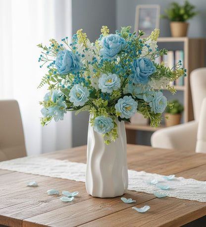 Plastic vase with lifelike artificial flower arrangement
