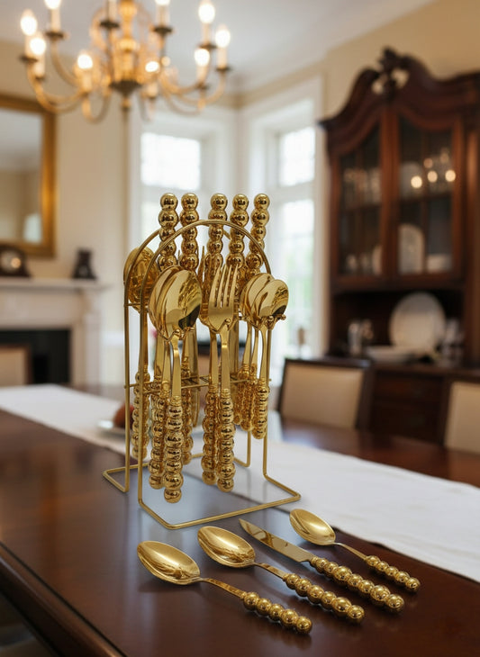 24-piece White and gold ceramic cutlery set with metallic gold stand.