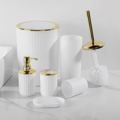 6-piece  round and square bathroom accessories set with gold and silver accents, including trash can, soap dispenser, soap dish, toilet brush with holder, toothbrush holder, and cup.