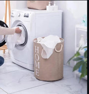 Round cotton linen laundry basket, foldable, durable, breathable, and portable for bedroom or bathroom use. 