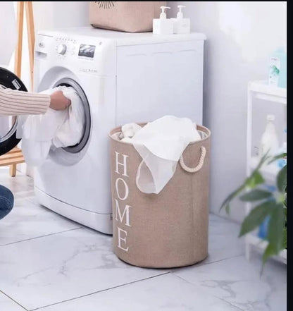Round cotton linen laundry basket, foldable, durable, breathable, and portable for bedroom or bathroom use. 