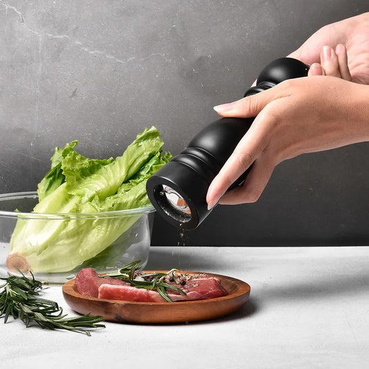 6-inch wooden pepper grinder with adjustable stainless steel mill, black finish, for fine or coarse seasoning. 