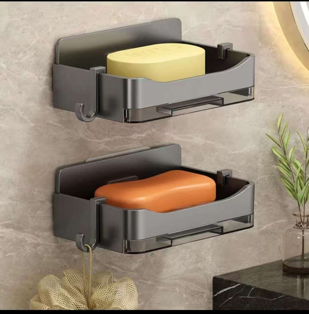 Cute soap holder with draining tray and hooks designed to keep soap dry and organize sink accessories.