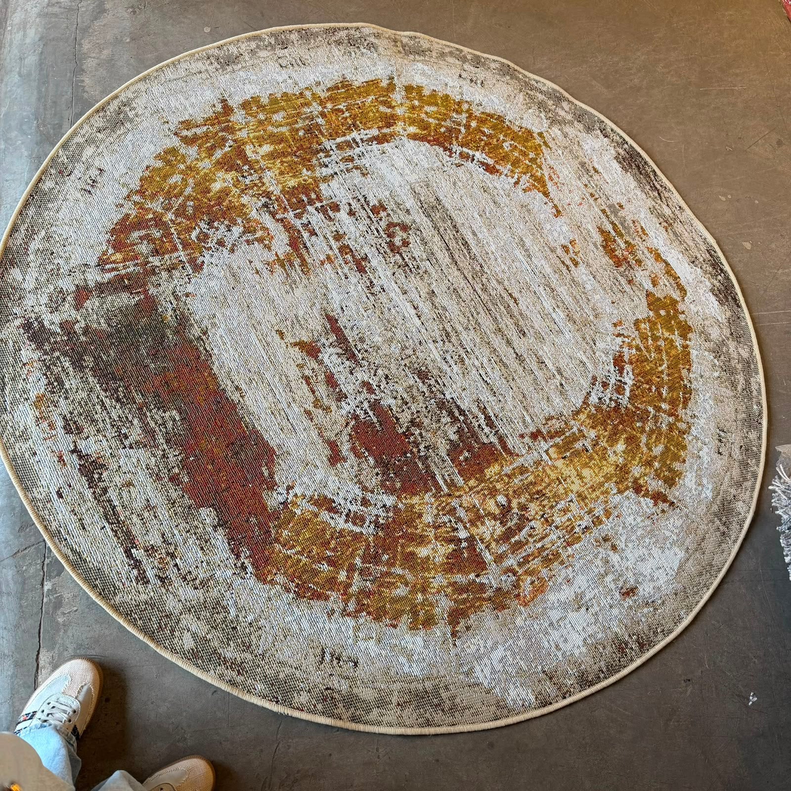 
Oriental Weavers Isla round abstract vintage rug with distressed cream, gold, rust, brown and charcoal design.